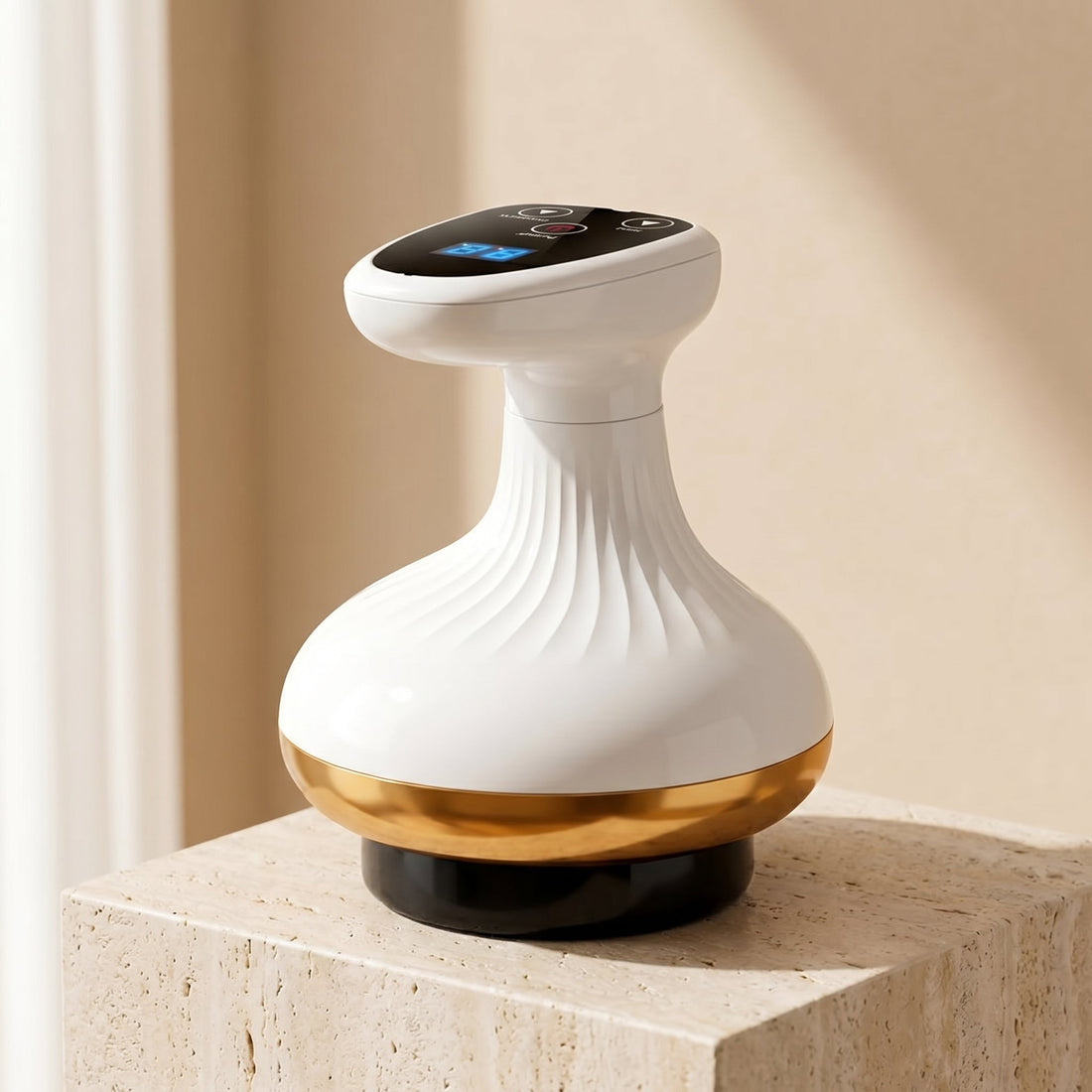 ContourZen cupping massager with gold band on a travertine pedestal