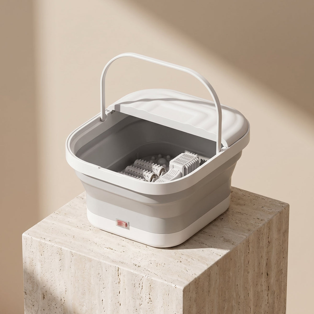 SoakZen foldable foot spa on a travertine pedestal beige studio
