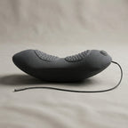 Side profile of the ArchZen lumbar cushion showing its curved ergonomic shape