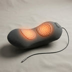 ArchZen lumbar cushion with both massage domes glowing warm for heat compress