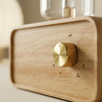 AromaZen diffuser brass control knob close-up with OFF dial