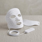 GlowZen white silicone LED face mask shown at an angle with the neck piece