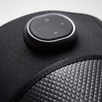 Close-up of the KneeZen control pod on the smooth neoprene above the quilted panel