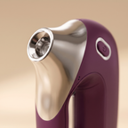 Close-up macro of the wine-purple HydraZen nozzle tip showing silver applicator detail
