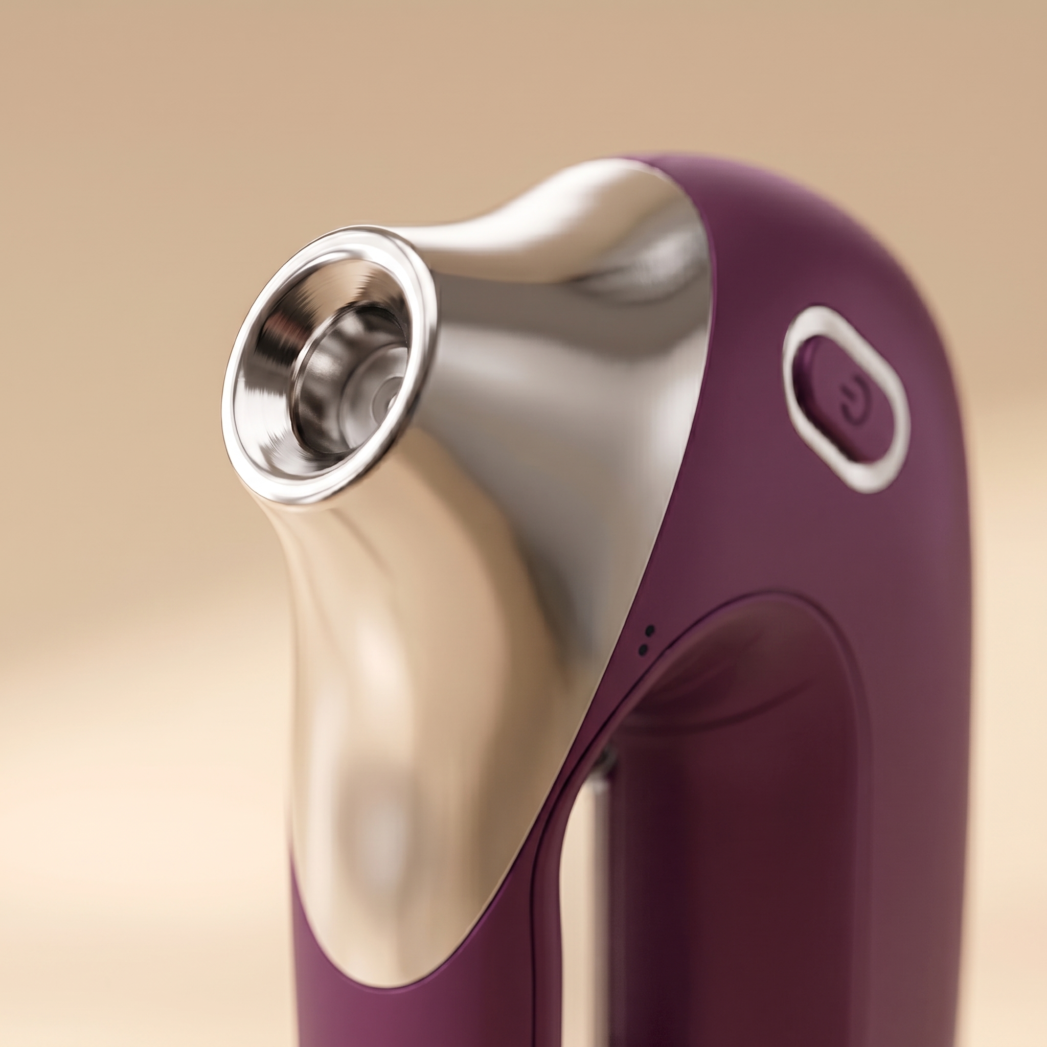 Close-up macro of the wine-purple HydraZen nozzle tip showing silver applicator detail