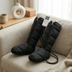 LegZen leg compression boots and white LCD remote arranged on a sofa