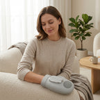 Woman relaxing with her hand inside the PalmZen grey hand massager