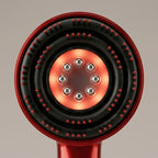 Close-up of the RelaxZen scalp comb head with red light and eight metal guide balls