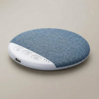 SnoozeZen under-pillow sleep speaker in blue, round with white control panel