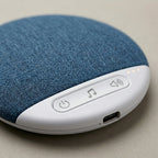 Close-up of the SnoozeZen control panel with power, music and sound buttons and USB-C port