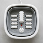 Top-down view inside the SoakZen foldable foot spa showing massage rollers, heater and bubble jet