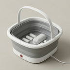 SoakZen collapsible foot spa shown open with carry handle and massage rollers
