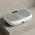 VibeZen vibration plate shown at an angle with gray concentric deck and display