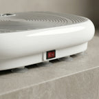 Detail of the VibeZen red rocker power switch and gray suction-cup feet