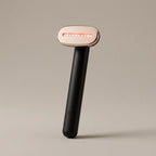 WandZen LED glow face wand, matte black handle with rose-gold red-light head