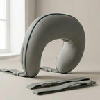 WrapZen massager side view showing the soft gray shell and adjustable straps