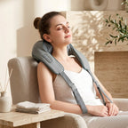 WrapZen shoulder massager in use with a calm, relaxed posture