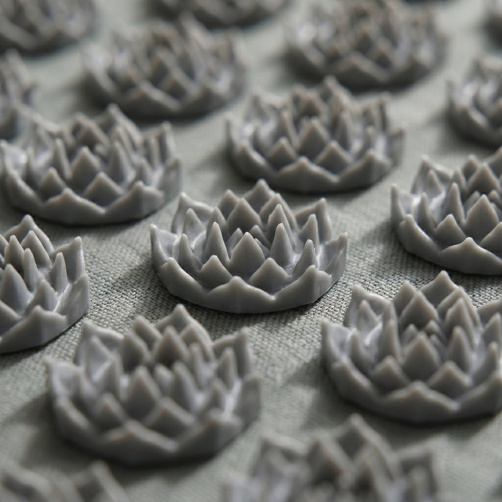 Close-up of the gray lotus spike discs on the AcuZen mat