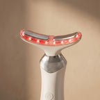 Close-up macro of AuraZen curved applicator head with red LEDs