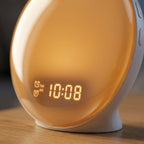 Close-up of DawnZen clock face and digital display with soft amber illumination