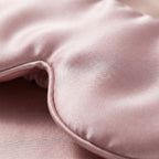 Close-up of smooth pink mulberry silk fabric and padded edge