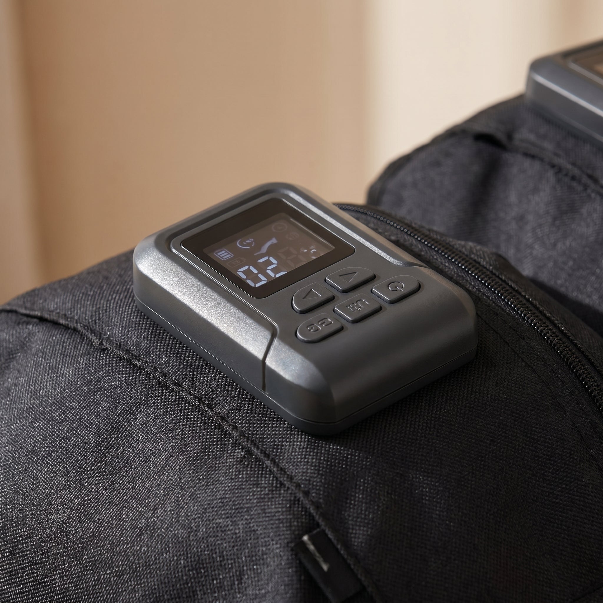 Close-up of the FlowZen boot controller buttons and display