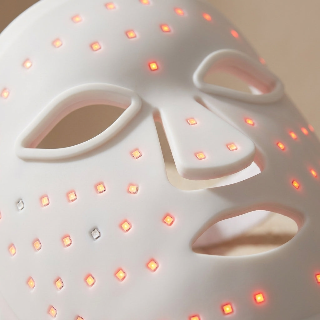 Close-up of GlowZen Neck mask LED panel showing individual light points