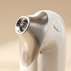 Close-up macro of HydraZen nozzle tip showing silver applicator detail