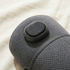 Close-up of KneeZen oval control pod with round buttons on diamond-texture neoprene