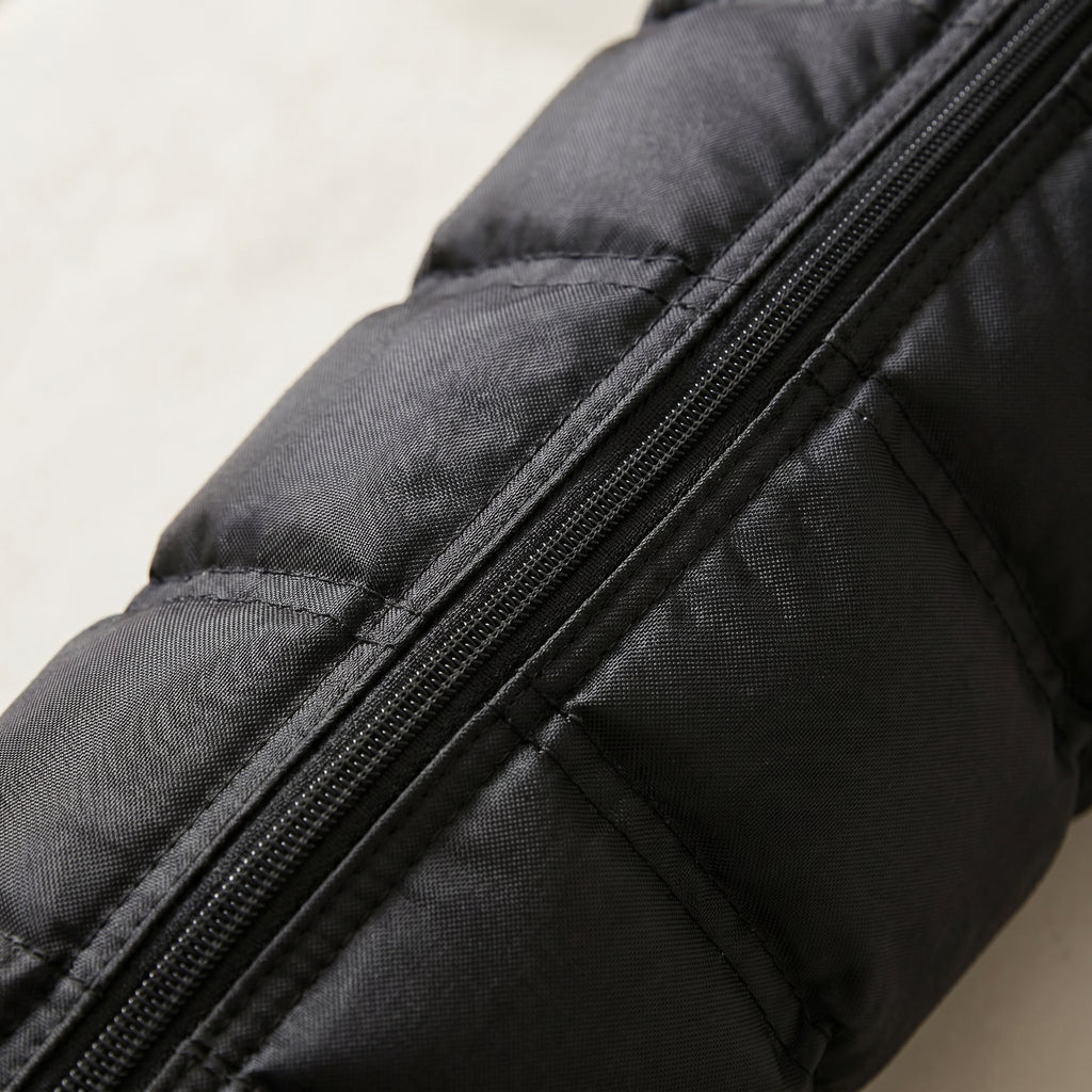 Macro detail of LegZen boot quilted fabric texture and zipper seam