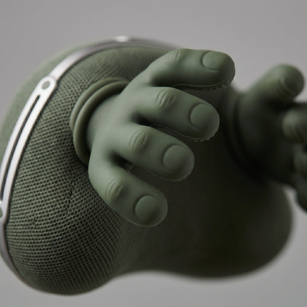 Close-up macro of NeckZen silicone massage fingers and mesh body detail