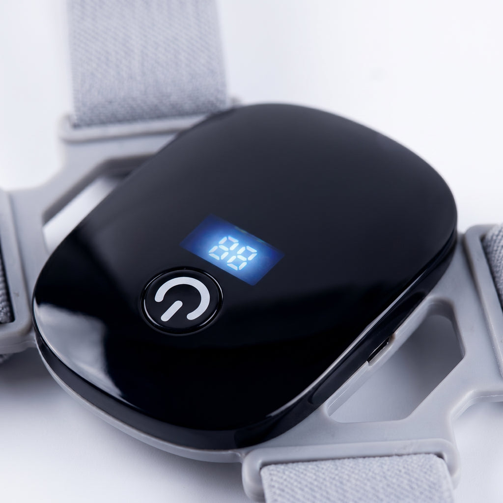 Close-up of the PostureZen power button and blue digital display