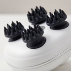 Close-up of ScalpZen rotating massage heads with flexible silicone tips