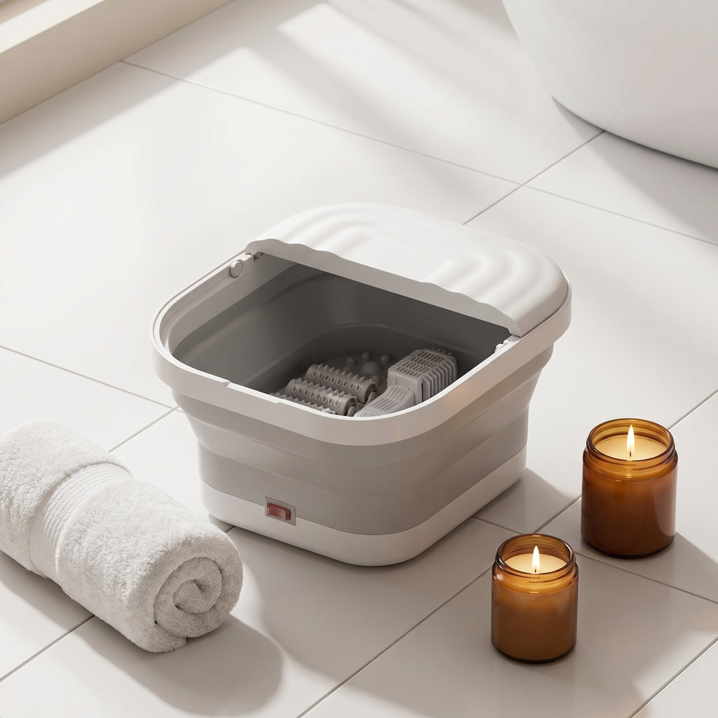 SoakZen foot spa tub on bathroom floor tiles with towel and candle