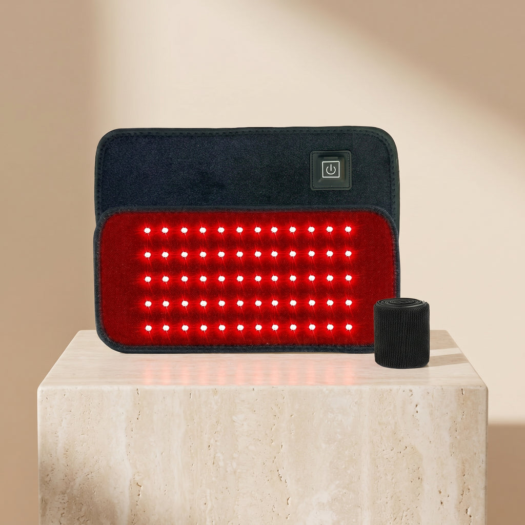 ThermaZen red light belt pad with strap on a travertine pedestal