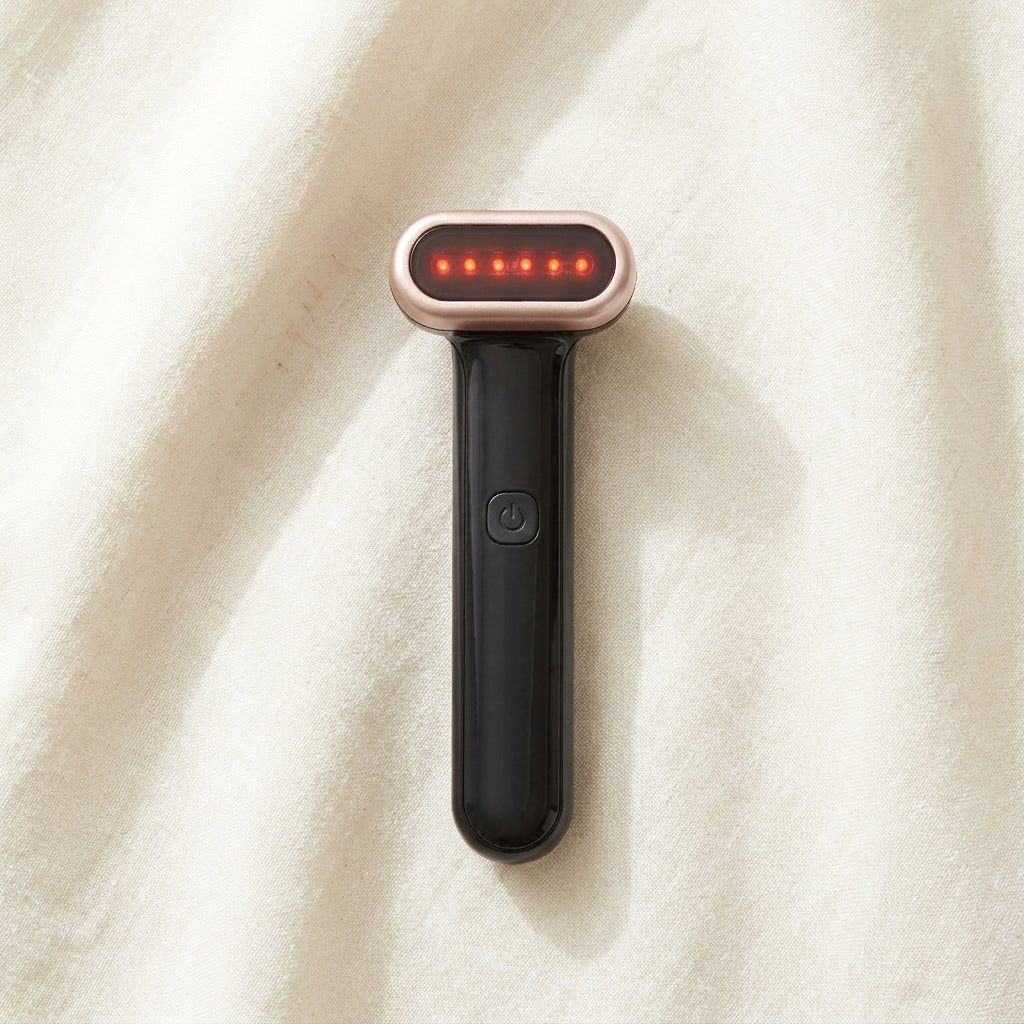 WandZen red light wand flat lay on cream linen in airy natural daylight