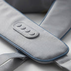 Close-up of WrapZen control panel buttons on soft gray fabric with blue trim
