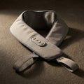 WrapZen shoulder wrap on dark gray stone with dramatic side lighting